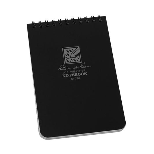 Rite in the Rain 4x6 black waterproof spiral notebook with gray tinted pages open showing grid pattern