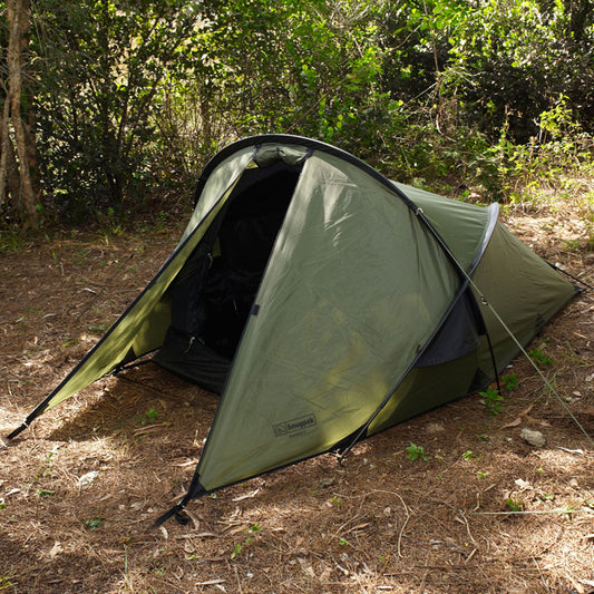 Snugpak Scorpion 2 IX olive green two-person tent set up outdoors showing sleek angled profile and front porch area