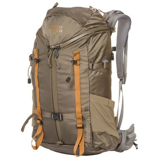Mystery Ranch Scree 32 backpack in wood color showing 3-ZIP design and external water bottle pockets