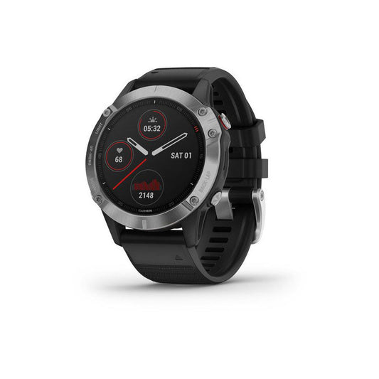 Garmin Fenix 6 GPS watch with silver case and black silicone band showing digital display