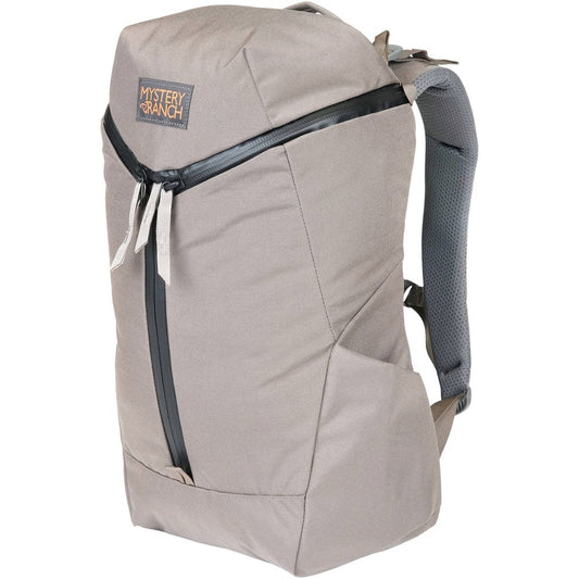 Mystery Ranch Catalyst 22 backpack in sagebrush color showing front panel organization and laptop compartment access